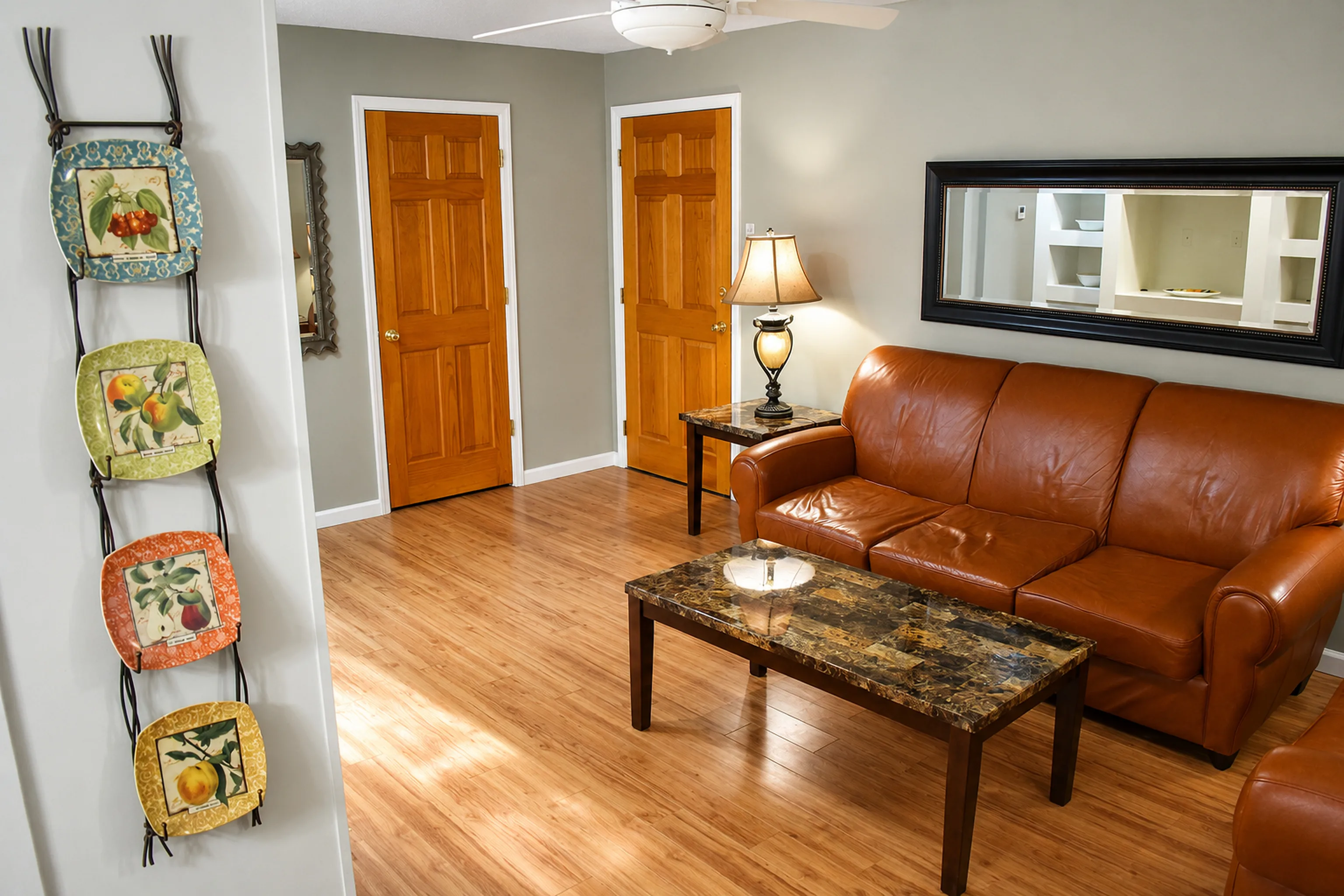 Furnished living room and entry view in apartment 1305 D